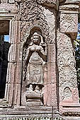 Ta Prohm temple - devatas sculpted on the gallery walls